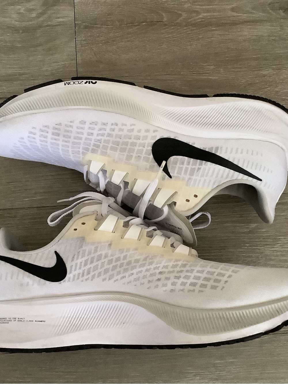 Nike Men's White Running Shoes with Black Swoosh Accent